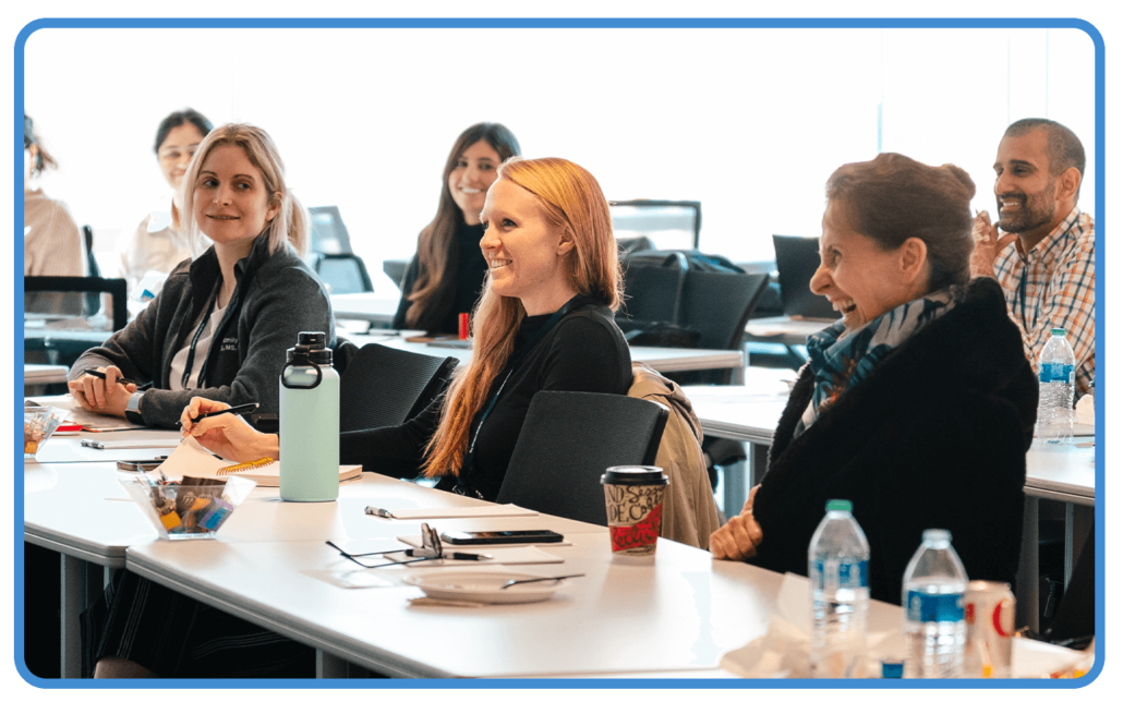 Woman smiles in group setting atDawson Academy Core 1 Course